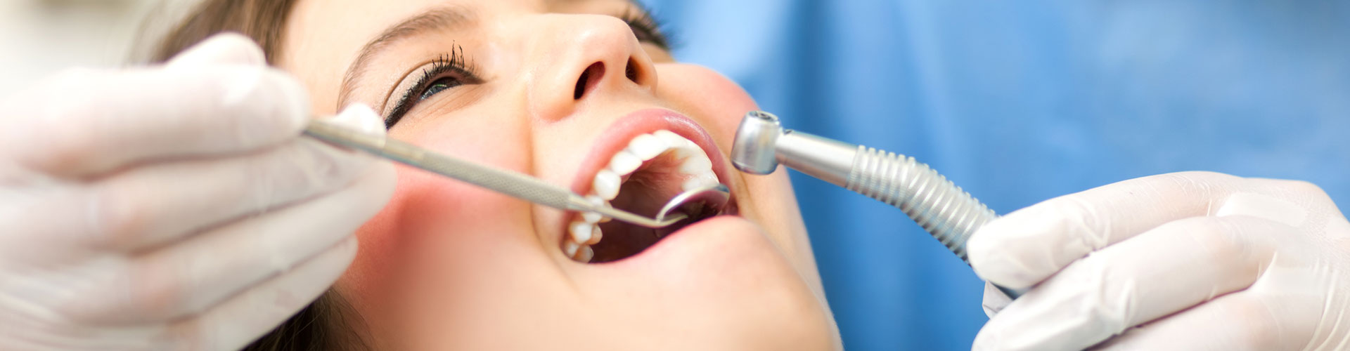 A woman having a dental exam at Bella Hanono Family Dentistry in Alpharetta, GA